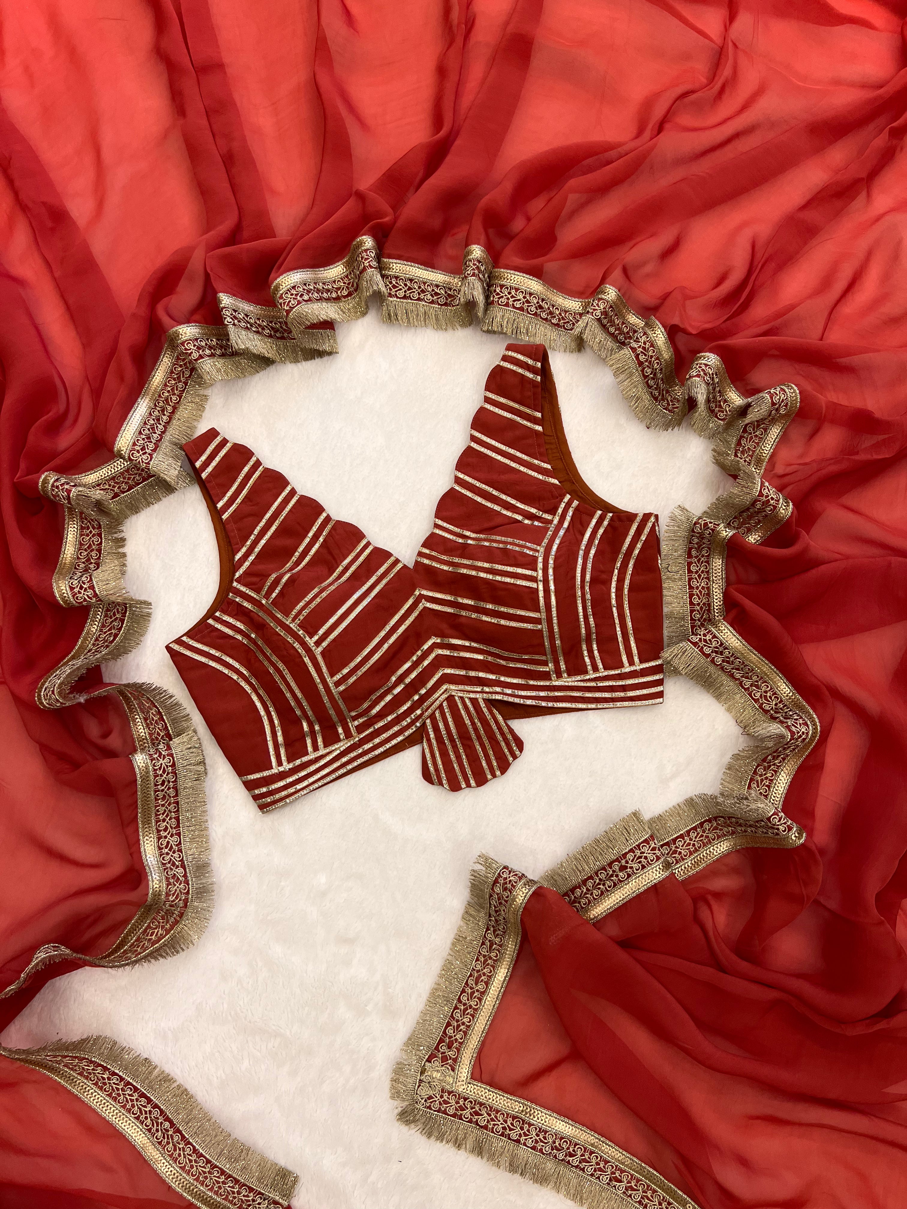 “Coral red designer organza saree by Sazrika”