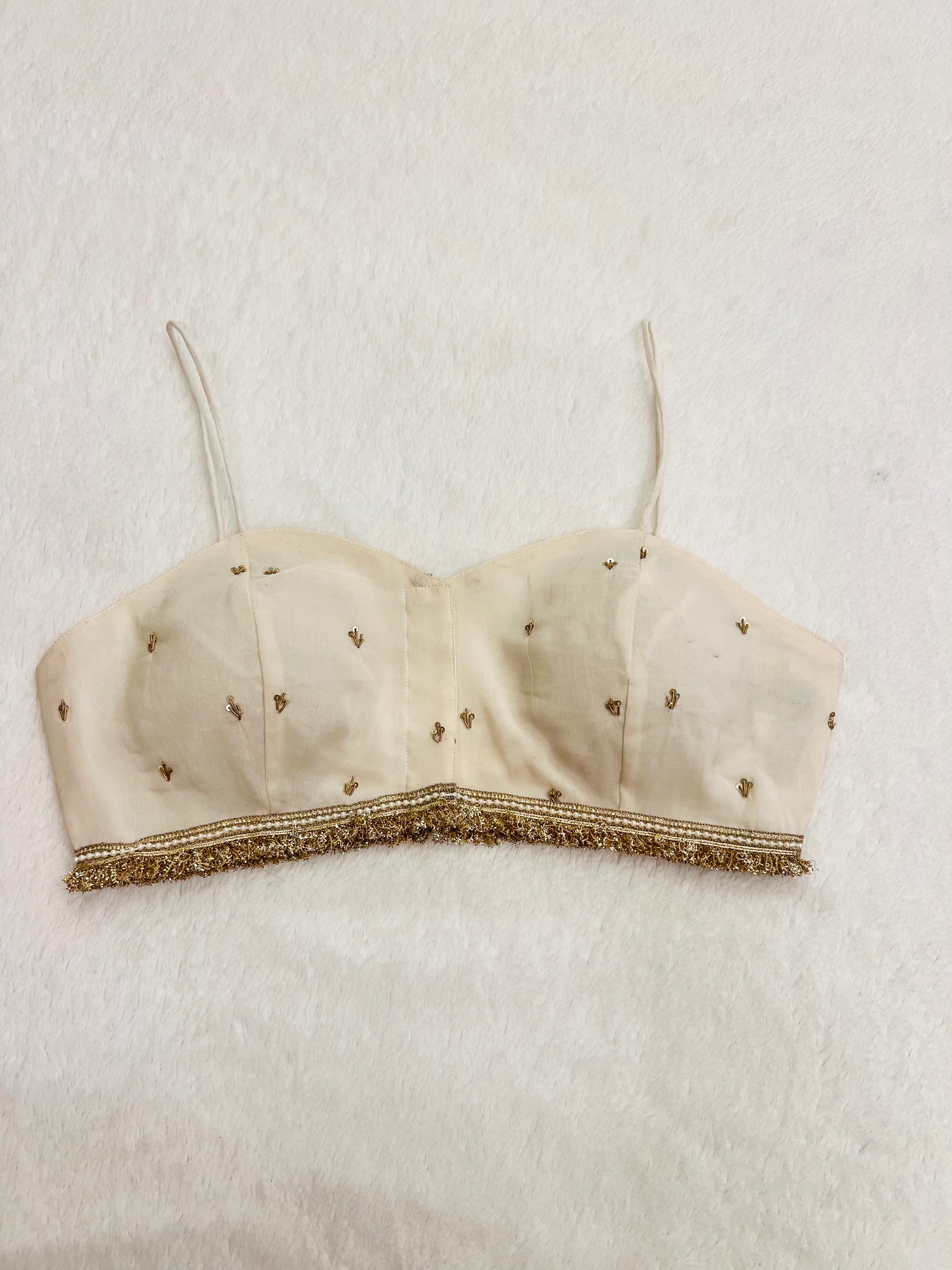 Gul-e-Bahar white organza sleeveless padded party wear blouse with handwork and V neck