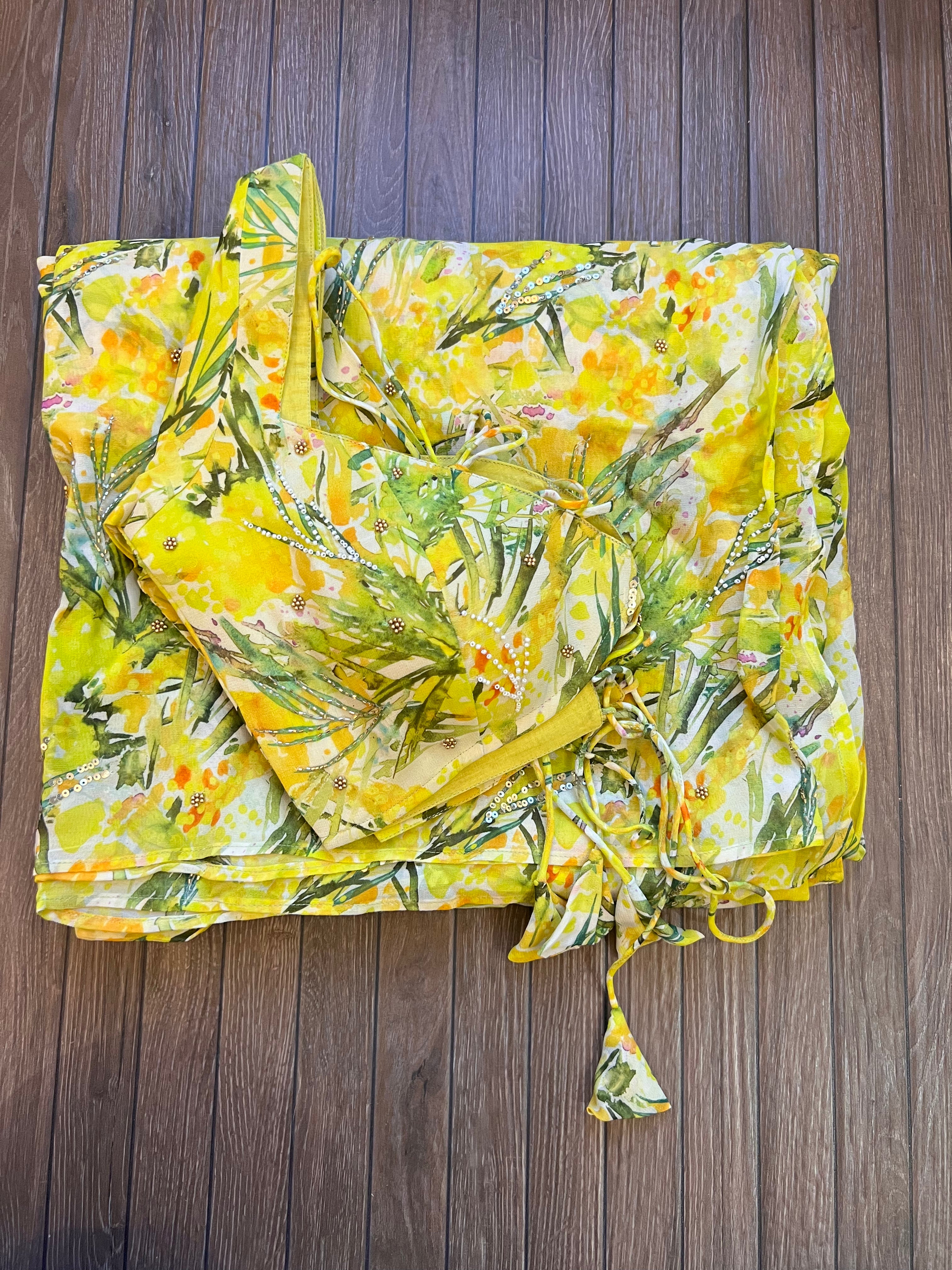 Lemon yellow georgette saree with stitched blouse