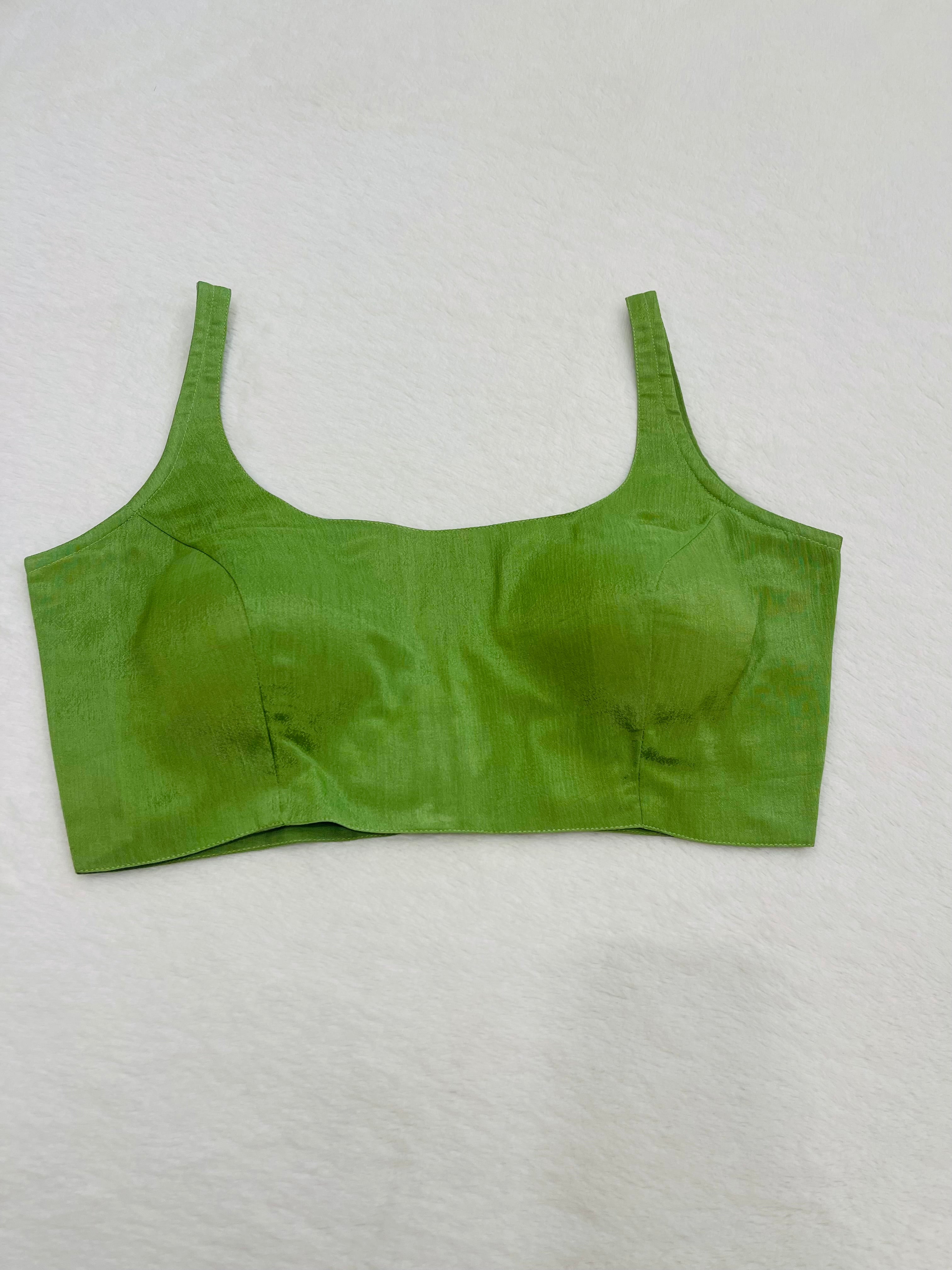 Lime green chiffon sleeveless padded blouse with round neckline – fully stitched ethnic wear top on flat background