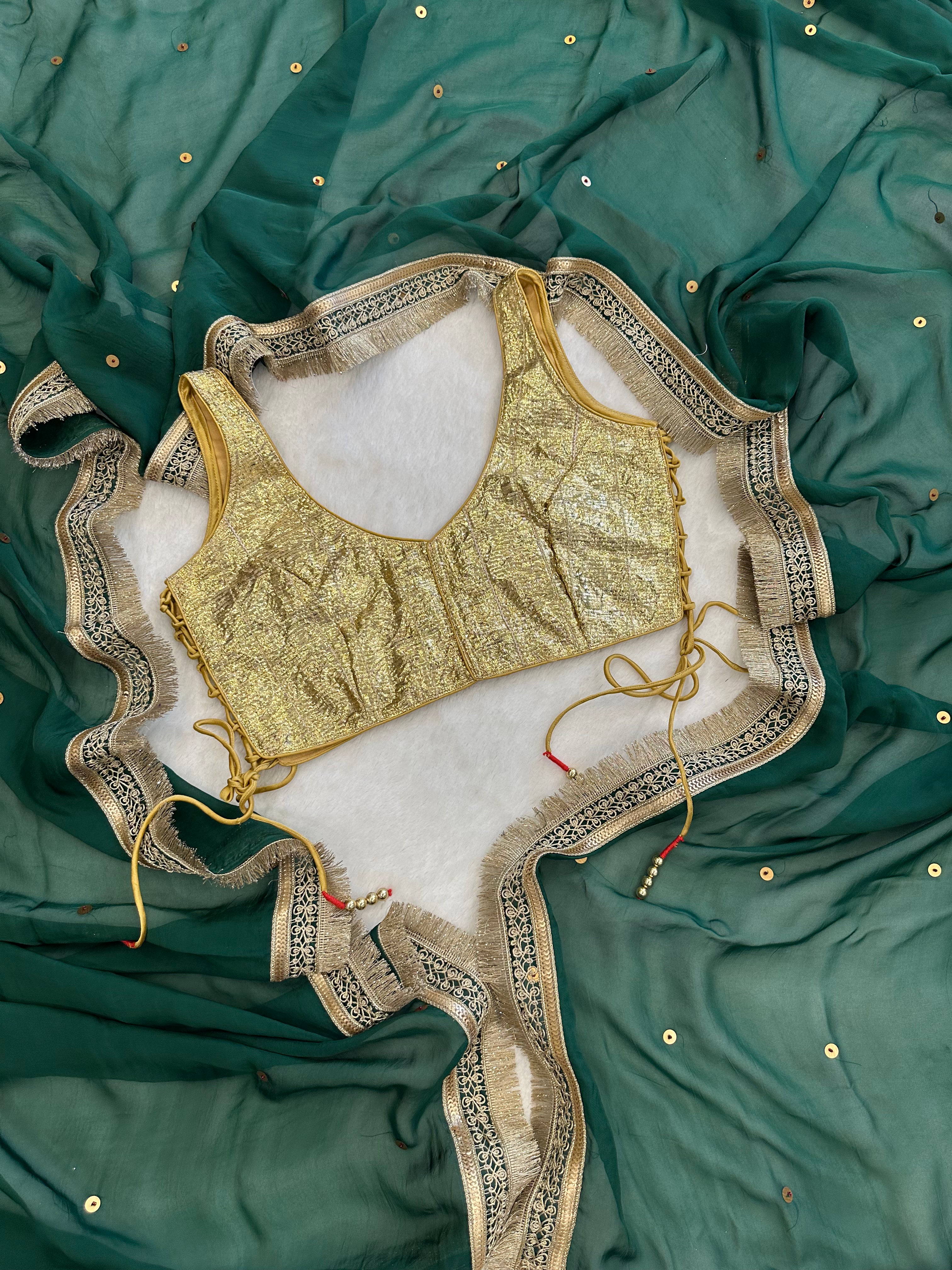 “Close-up of chumki embellishment on Nayrah green saree”