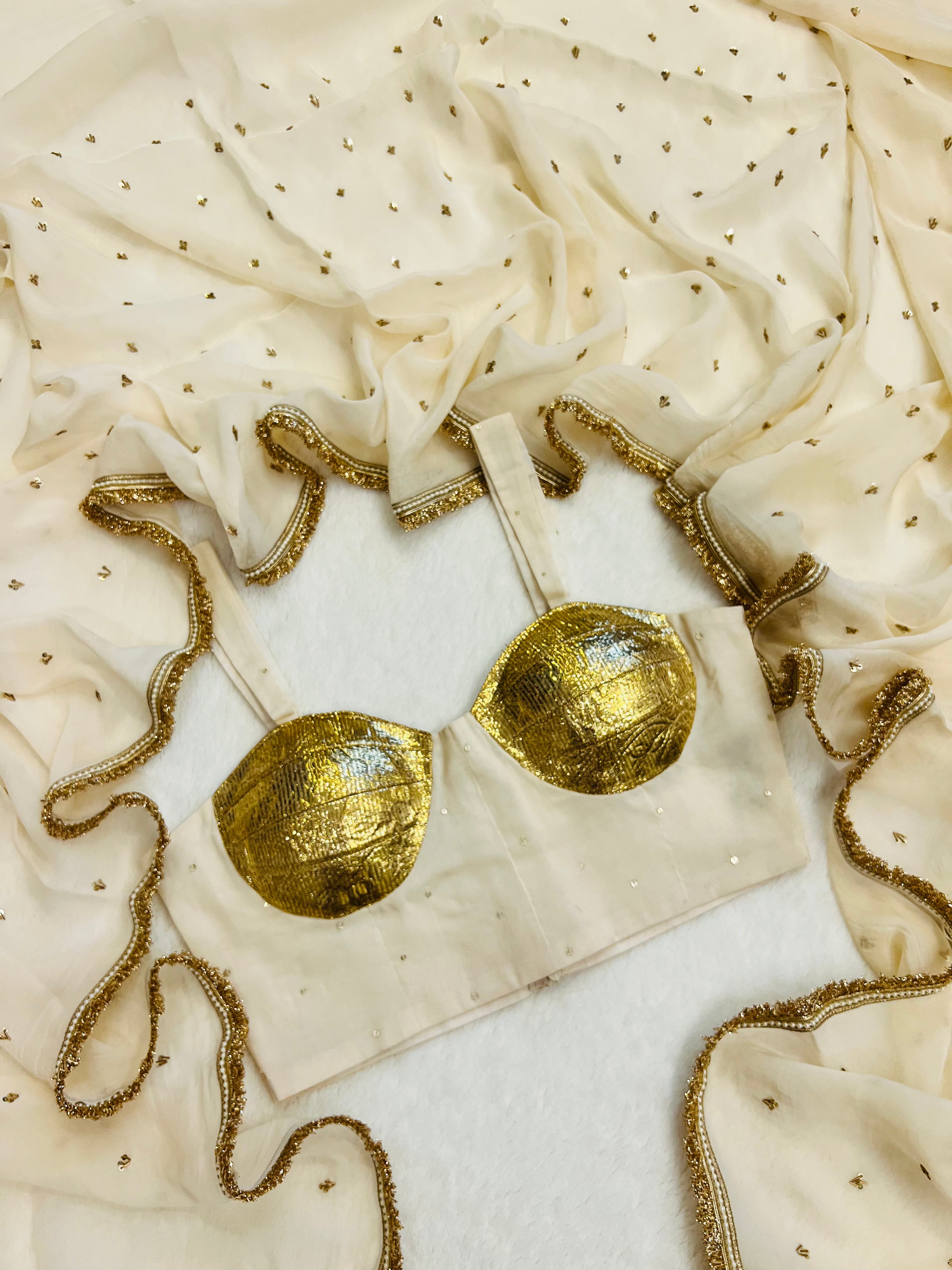 “White embroidered saree by Sazrika”