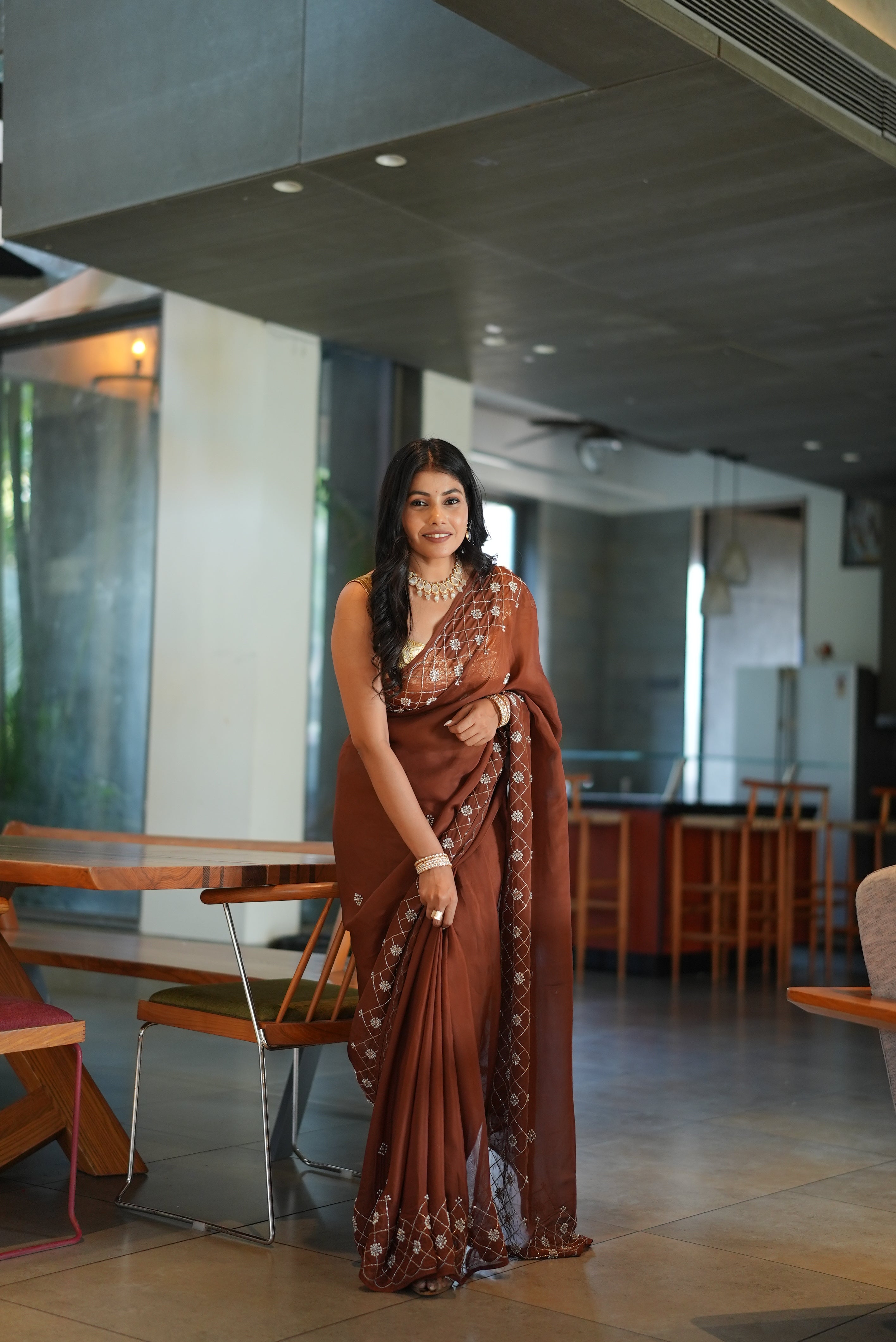 Designer organza saree with hand-embellished moti work