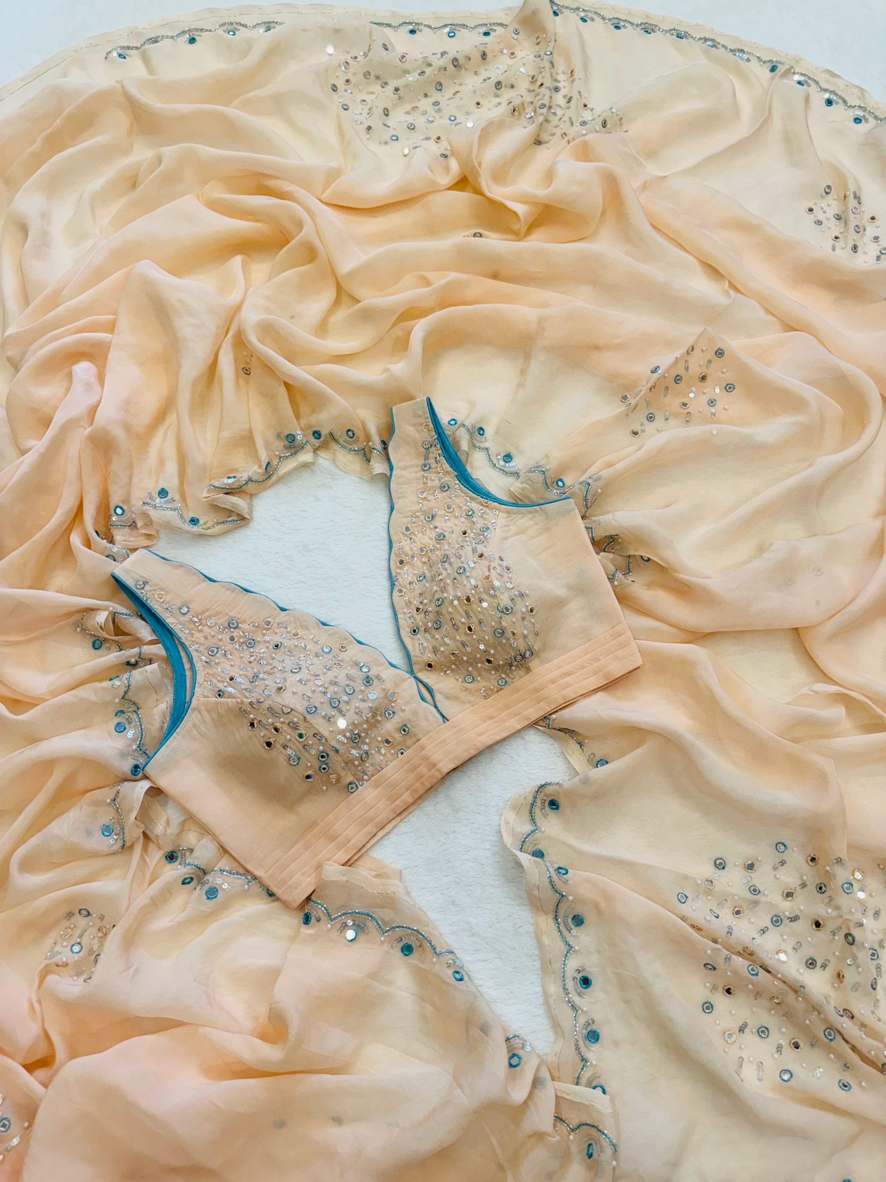 Peach stitched blouse paired with organza saree