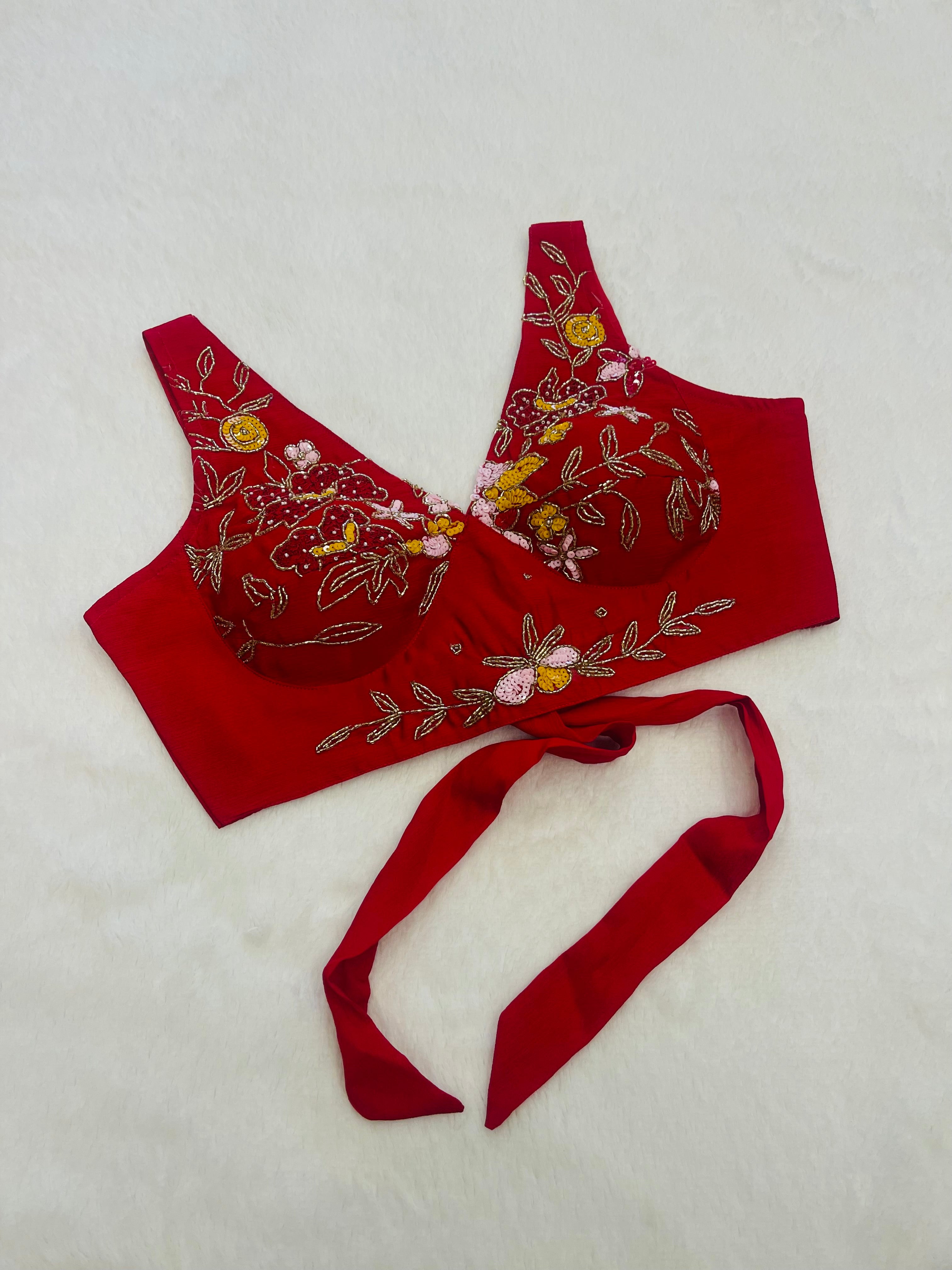 Women’s red chiffon saree with elegant embroidery