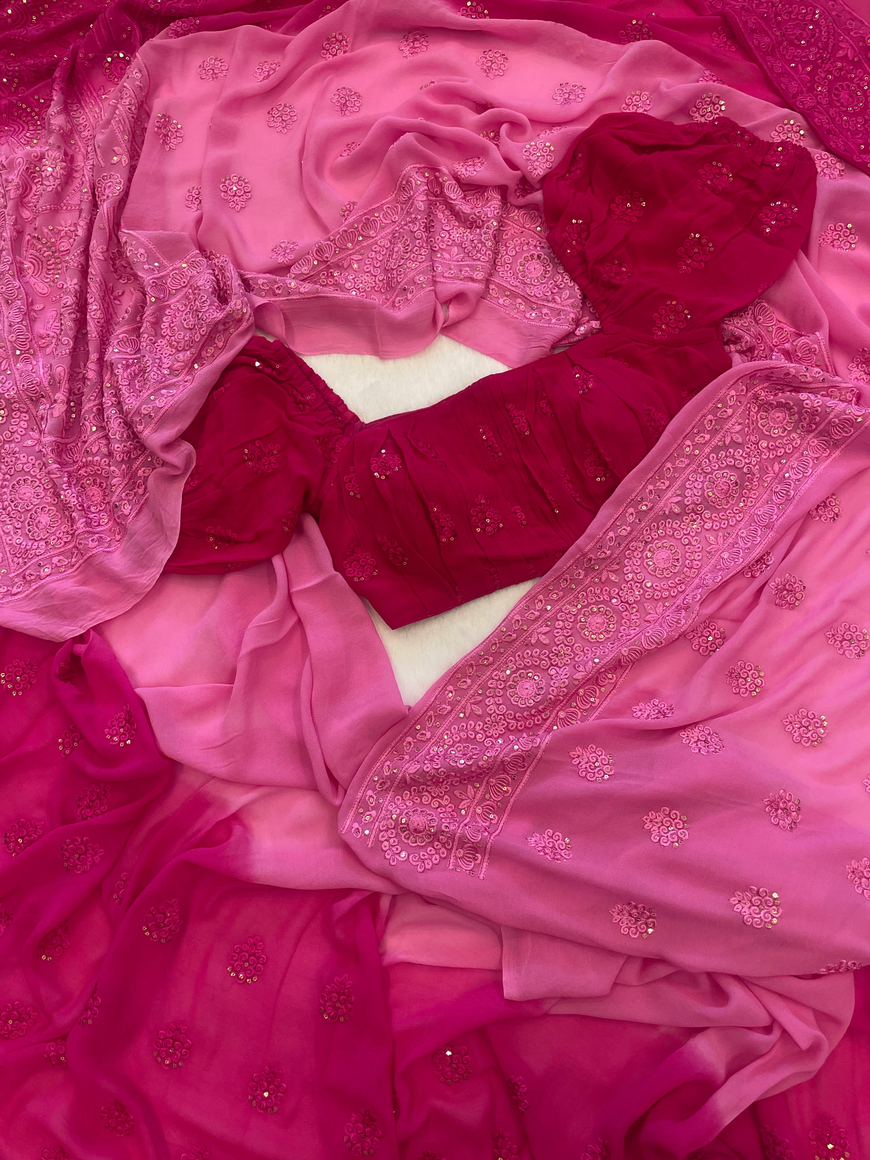 Pure georgette pastel pink and rani pink hand-dyed embroidered saree with stitched blouse