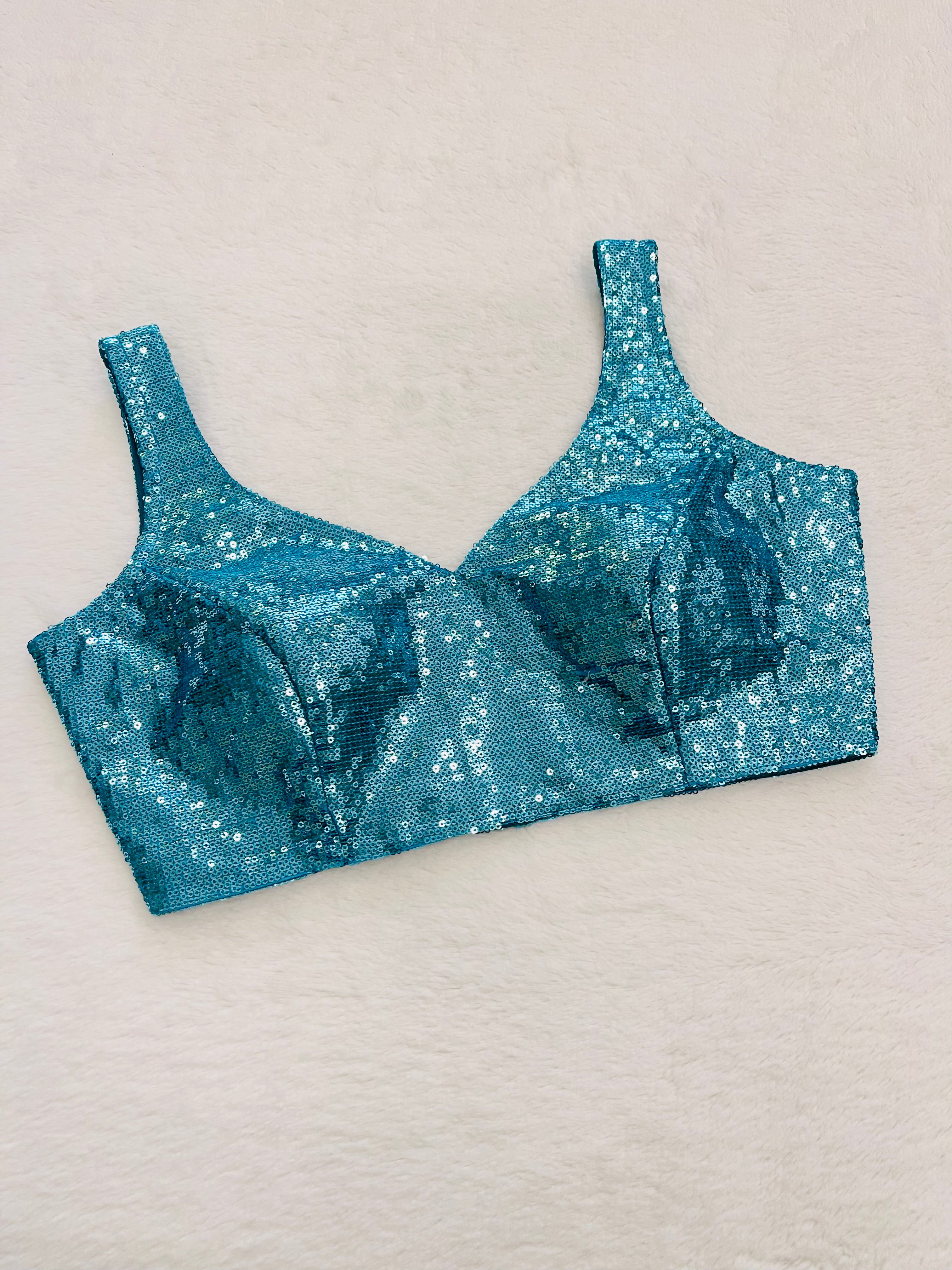 Sea blue georgette sleeveless blouse with padded cups and V-neck design