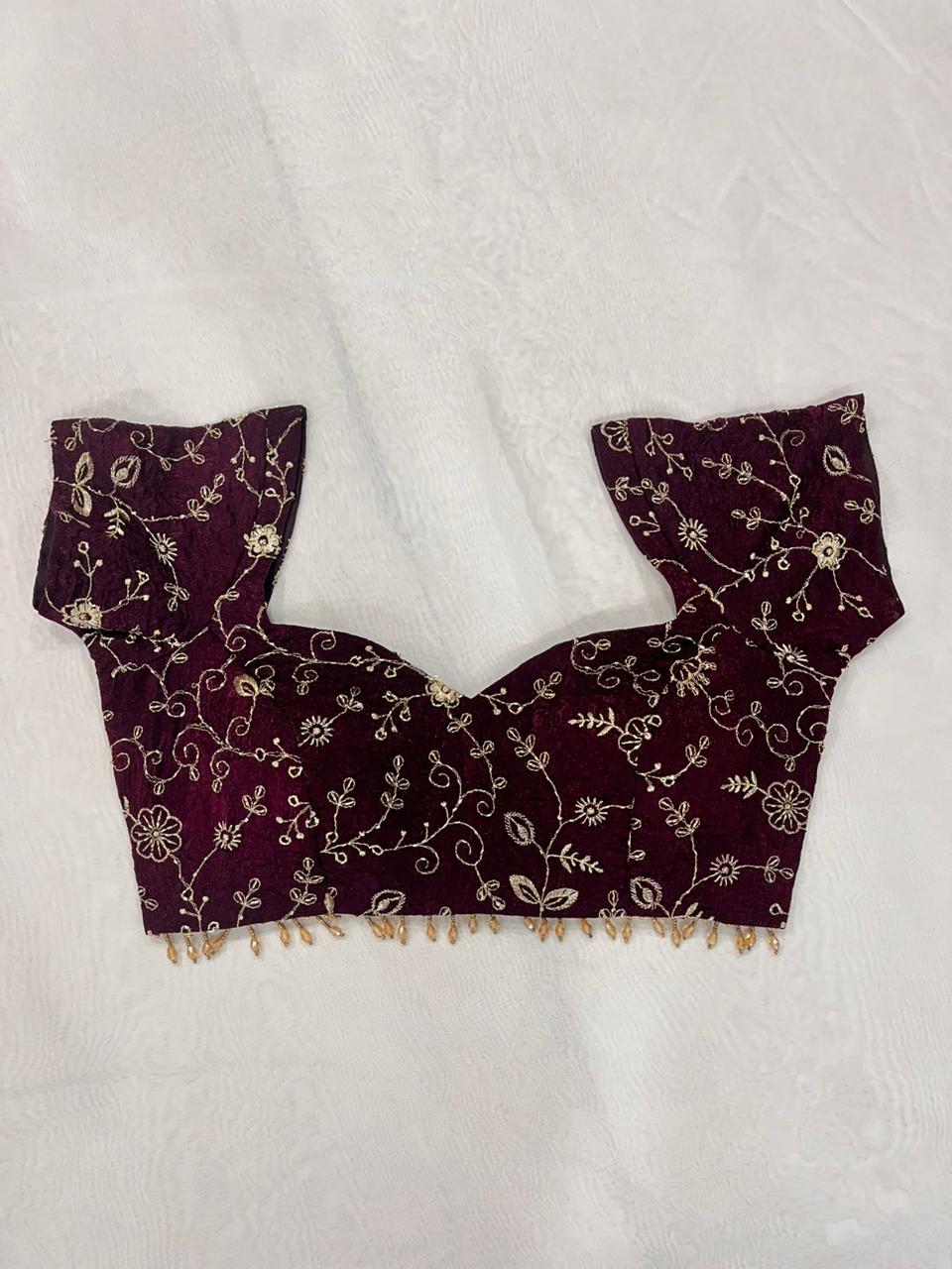 Wine organza blouse with sweetheart neck, cap sleeves, padded cups, and fully stitched design.