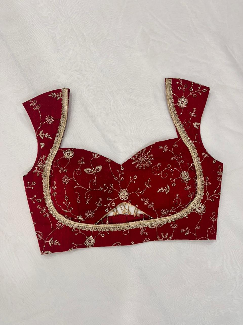 Crimson organza padded blouse with sweetheart neckline and sleeveless design