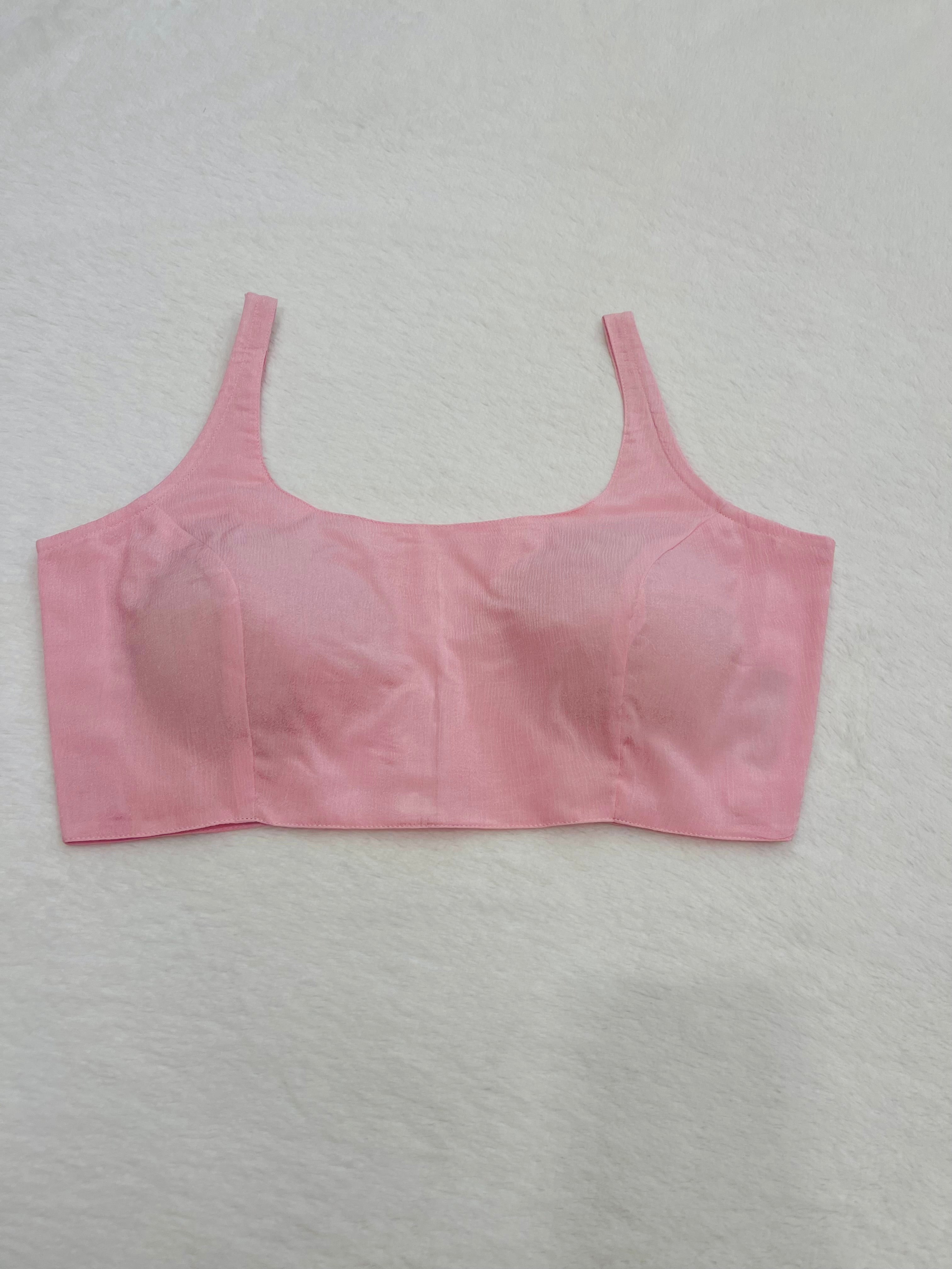 Baby pink chiffon sleeveless padded blouse with round neckline – fully stitched women’s ethnic top on flat background