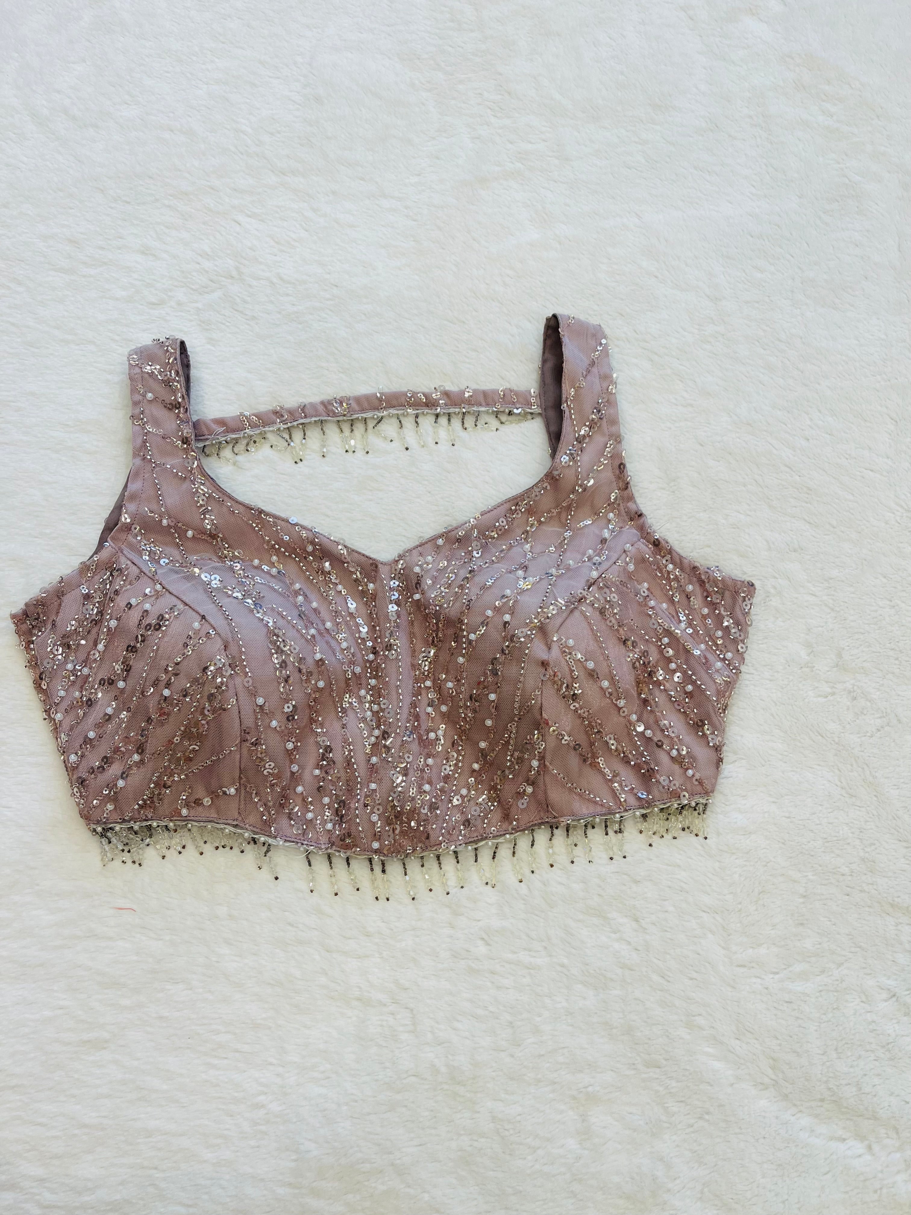 Baby pink georgette sleeveless V-neck padded blouse