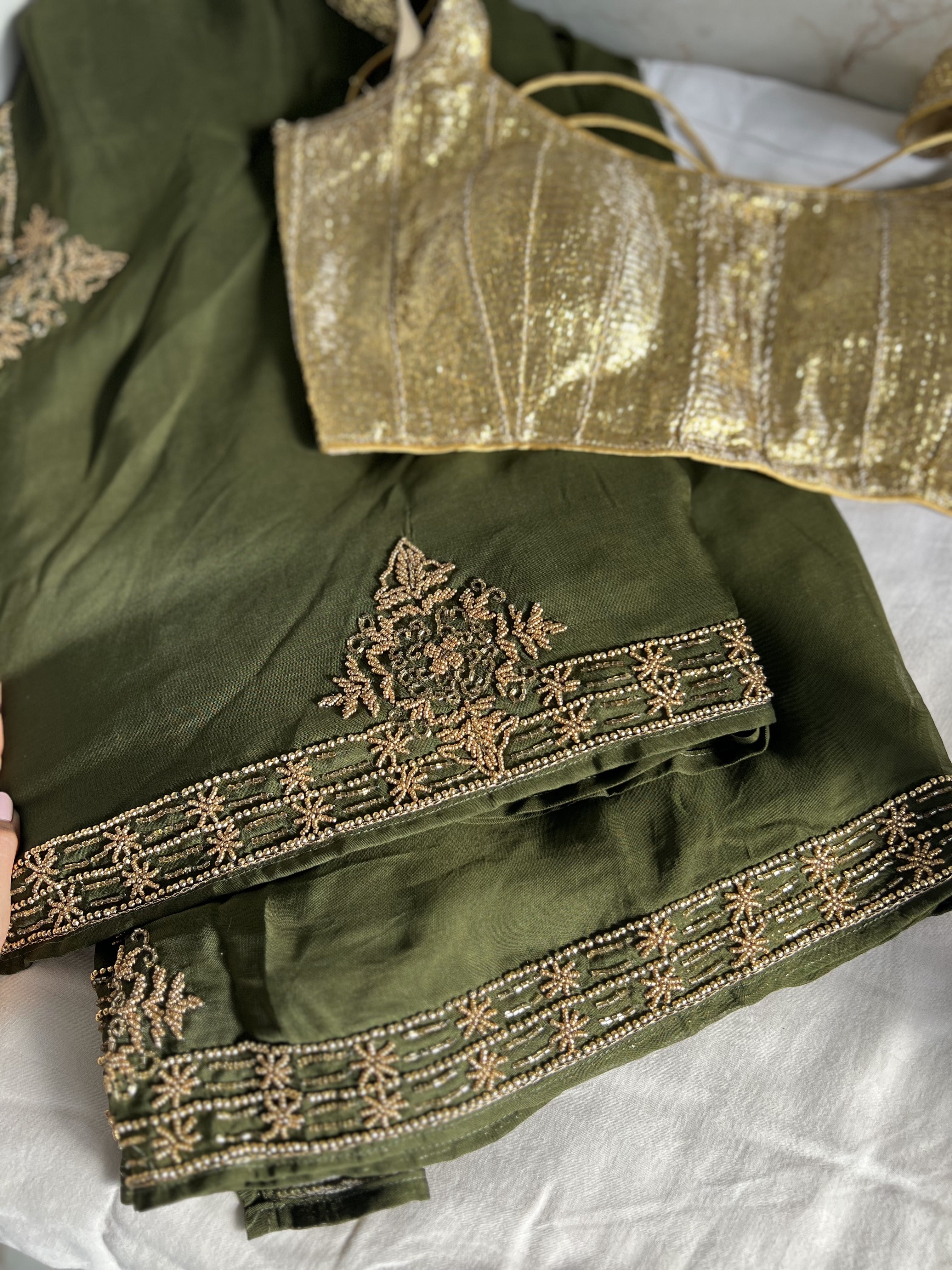 Olive green organza saree with antique handwork