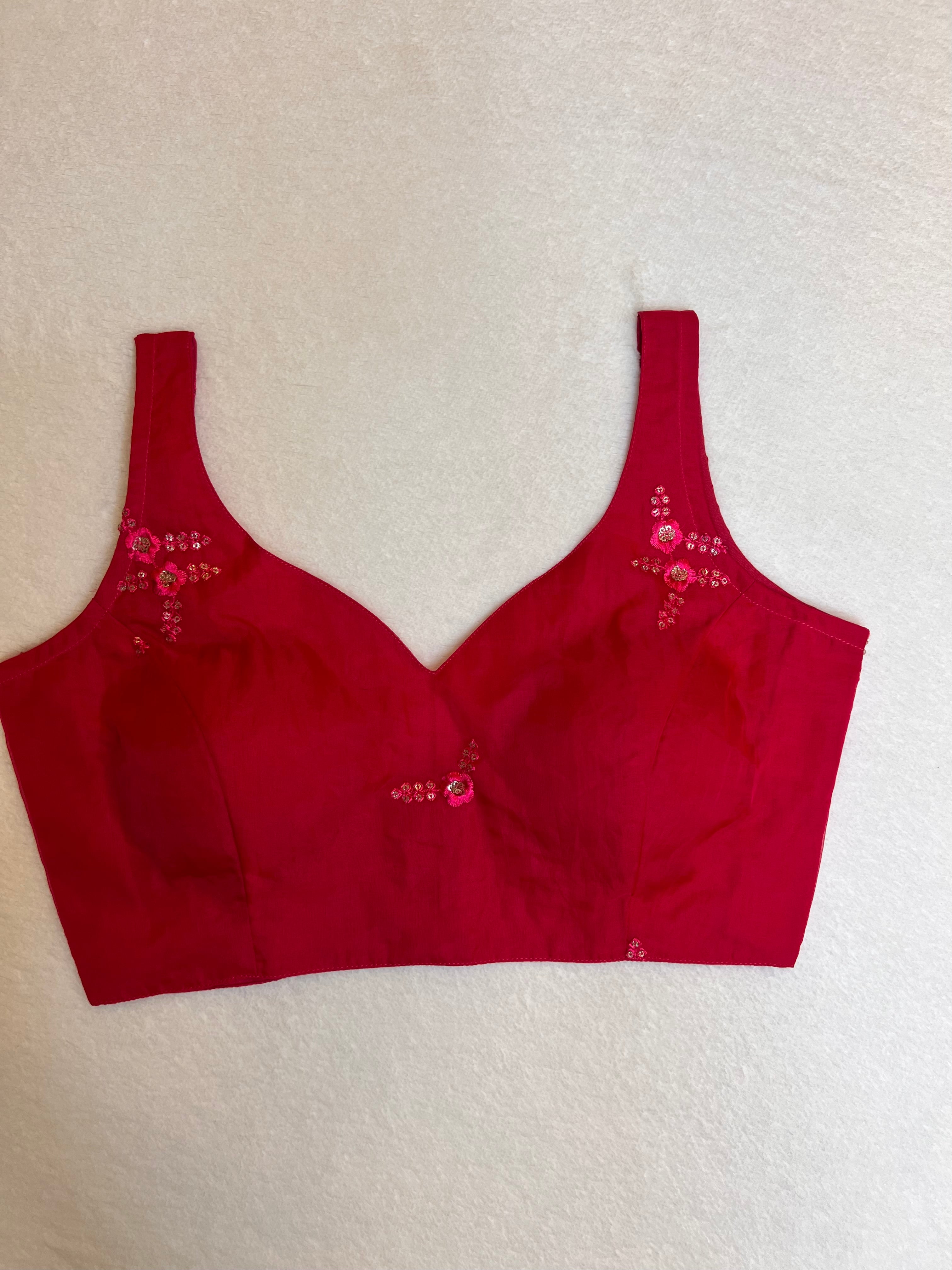 Rani pink organza sleeveless padded blouse with sweetheart neckline – fully stitched ethnic wear top on flat background