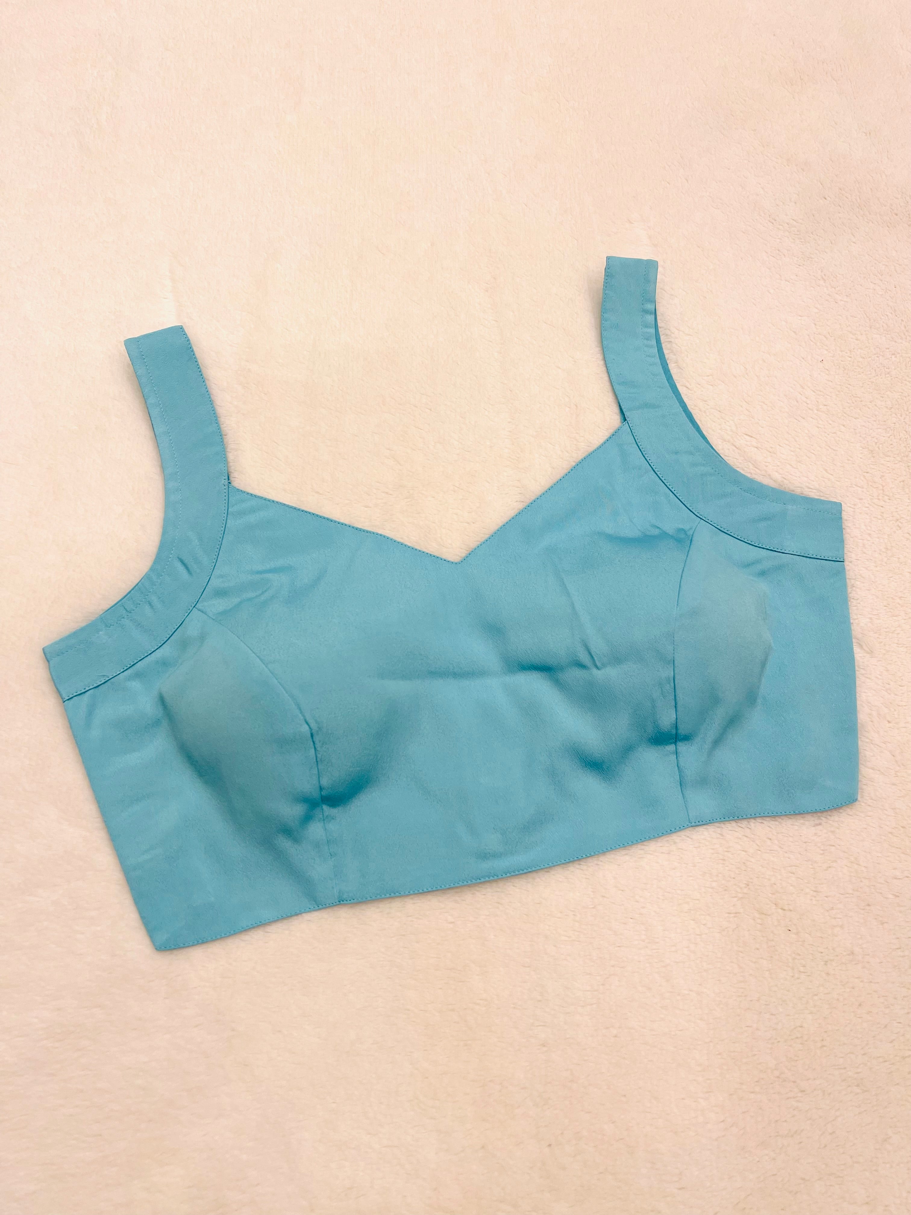 Women Turquoise crape silk sleeveless padded V-neck fully stitched blouse