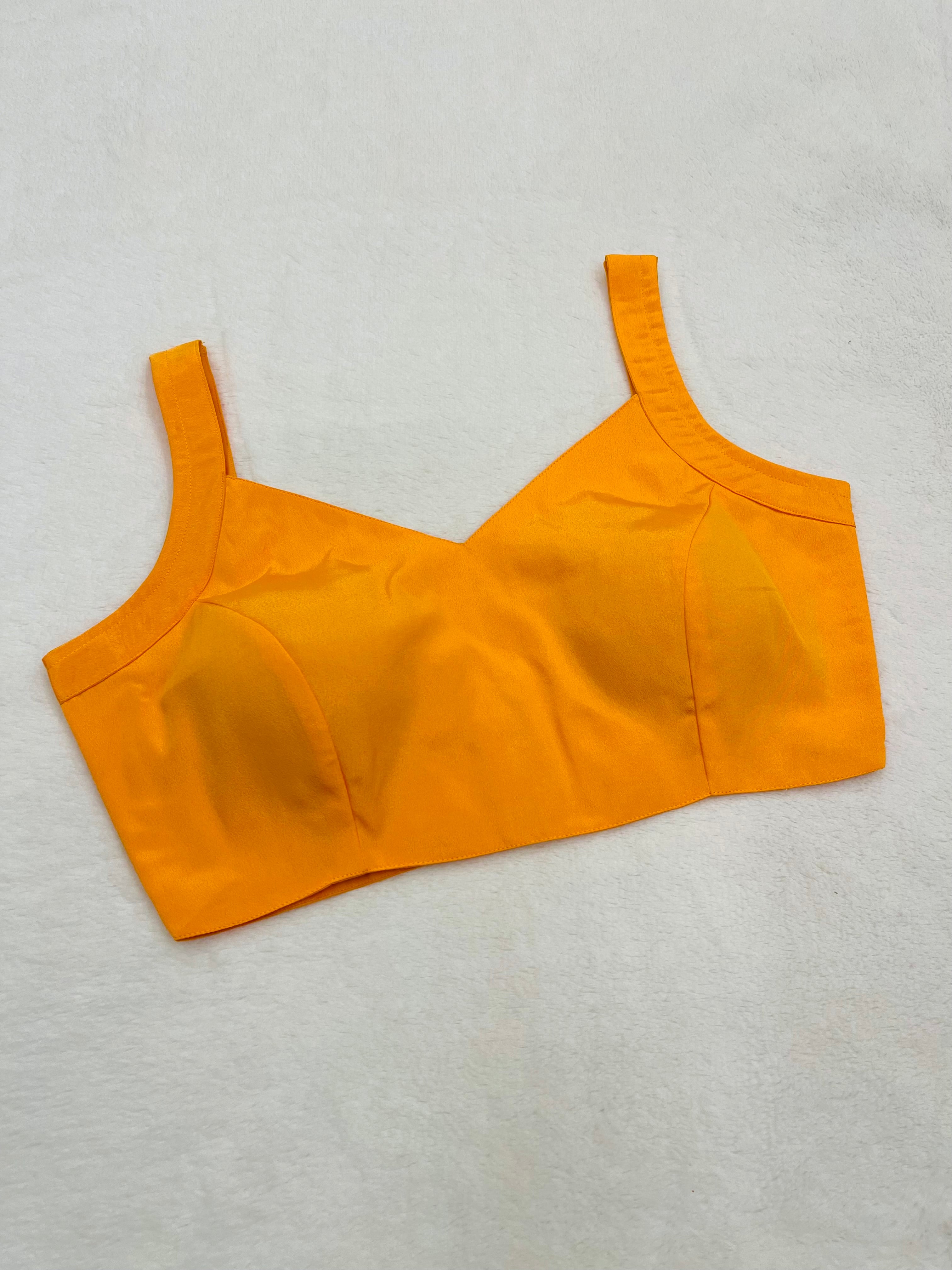 Women Yellow crape silk sleeveless padded V-neck fully stitched blouse