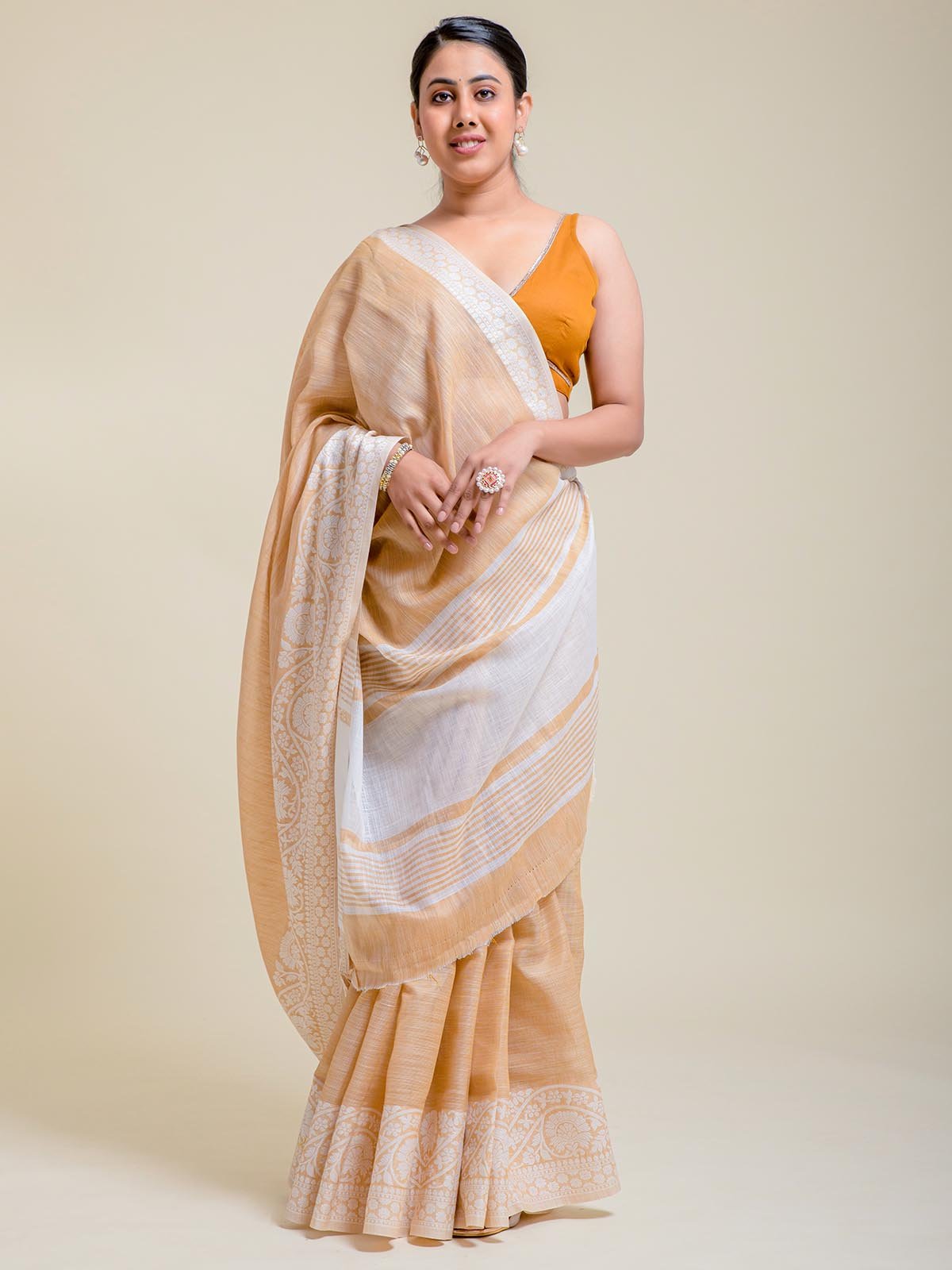 Peach linen saree with soft embroidery and running blouse piece”